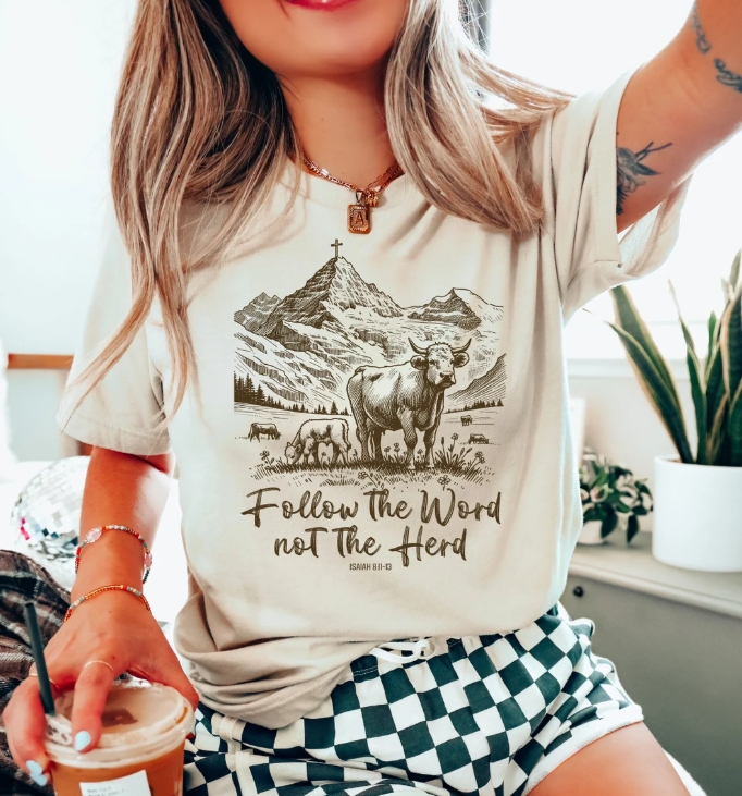 Woman wearing cow-themed graphic tee